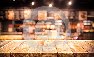 Wood table top Bar with blur light bokeh in dark night cafe,restaurant background