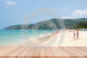 Wood table top on blue sea and white sand beach background