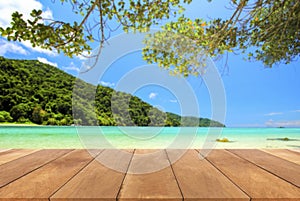 Wood table top and blue sky with seascape background