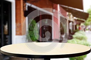 Wood table top on blur background of coffee shop & x28;or restaurant& x29;