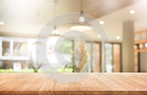 Wood table top with blur coffee shop or cafe,restaurant