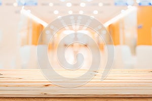 Wood table top on blur interior hotel background.