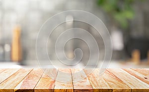 Wood table top on blur kitchen counter background