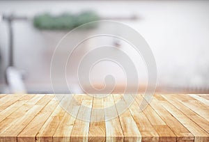 Wood table top on blur kitchen counter roombackground