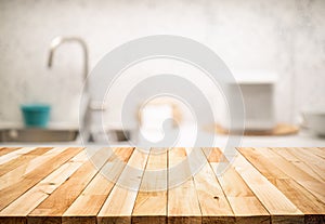 Wood table top on blur kitchen counter roombackground