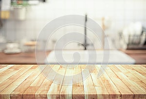 Wood table top on blur kitchen counter roombackground.For montage product display or design key visual photo