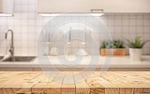 Wood table top on blur kitchen counter roombackground photo