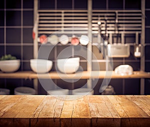 Wood table top on blur kitchen room background