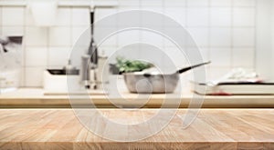Wood table top on blur kitchen room background photo