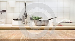 Wood table top on blur kitchen room background