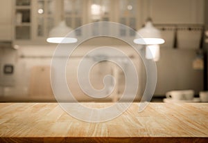 Wood table top on blur kitchen room background