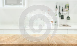 Wood table top on blur kitchen room background photo