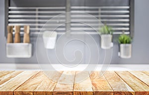 Wood table top on blur kitchen room background