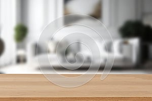 Wood table top on blur living room background