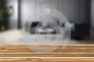 Wood table top on blur living room background