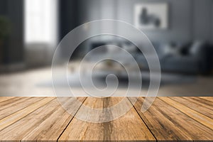 Wood table top on blur living room background