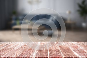 Wood table top on blur living room background