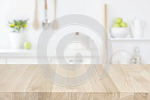 Wood table top on blur modern kitchen room counter background