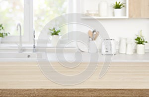 Wood table top on blur modern kitchen room counter background