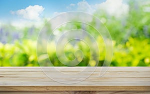 Wood table top on blur tree,garden in morning background.summer concept