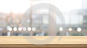 Wood table top on blur window glass,wall background