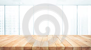 Wood table top on blur window glass,wall background