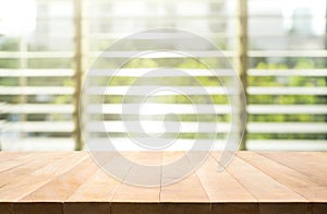 Wood table top with blur window shutters curtain background