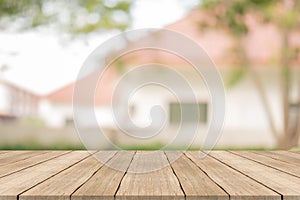 Wood table top on blurred background at garden,for montage your products