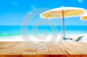 Wood table top on blurred beach background