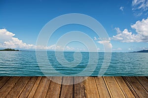 Wood table top on blurred blue sea background - can be used for display or montage your products