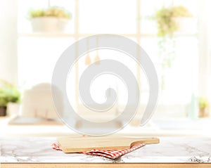 Wood table top on blurred kitchen background