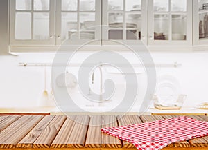 Wood table top on blurred kitchen background