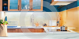 Wood table top on blurred kitchen background