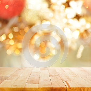 Wood table top on blurry gold background - festive background