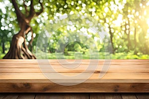 Wood table top it and bokeh background of a green tree garden