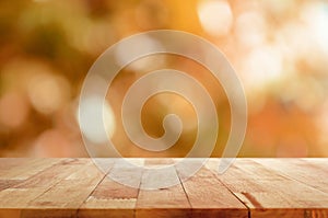 Wood table top on brown bokeh abstract background