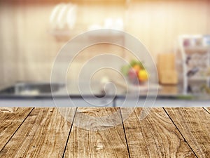 Wood table top in kitchen room blur background for montage product display or backdrop design layout