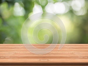 Wood table top on nature green blurred background,for montage yo