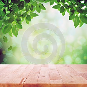 Wood table top on nature green bokeh abstract background