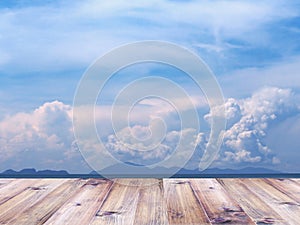 Wood table top over summer beach and blue sky