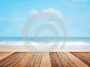 Wood table top over summer beach and blue sky