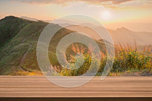 Wood table top podium floor outdoors misty mountain golden hour light sunset nature background.product placement pedestal present