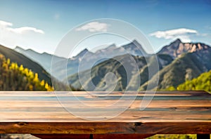 Wood table top on soft focus peak of mountain background. For montage product display.