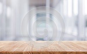 Wood table top on white abstract background form office building