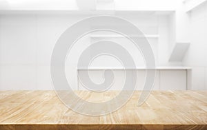 Wood table top on white room office background.