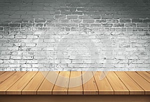 Wood table with White brick wall background