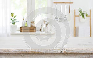 Wood tabletop on blur kitchen background for product display montage