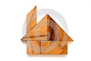 Wood tangram puzzle in home or house shape
