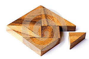 Wood tangram in square shape that wait triangle piece to fulfill on white background