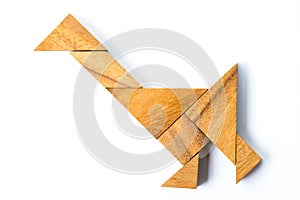 Wood tangram in walking swan or duck shape on white background